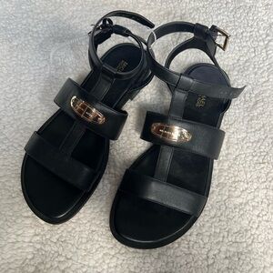 Black leather MK sandals with gold buckles
